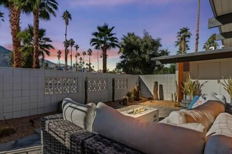 Private mid-century Palm Springs patio with fire pit perfection.