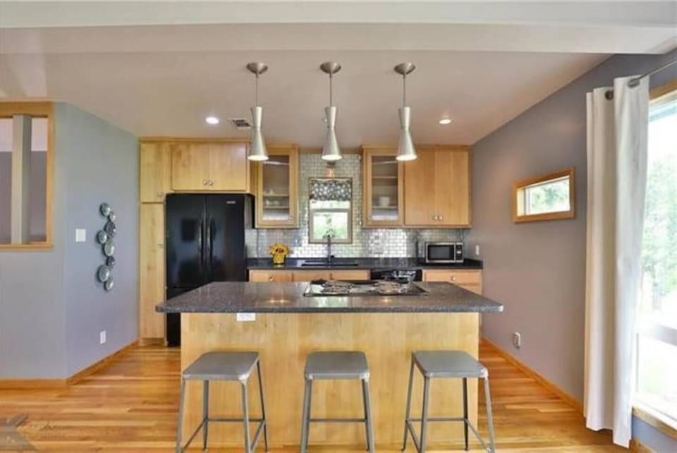 The kitchen is fully equipped with everything you need to cook a meal: stove & cooktop, refrigerator, dishwasher & microwave. Granite countertops offer plenty of space, with a seat-at bar. Pots/pans, dishware, coffee maker, toaster etc provided.