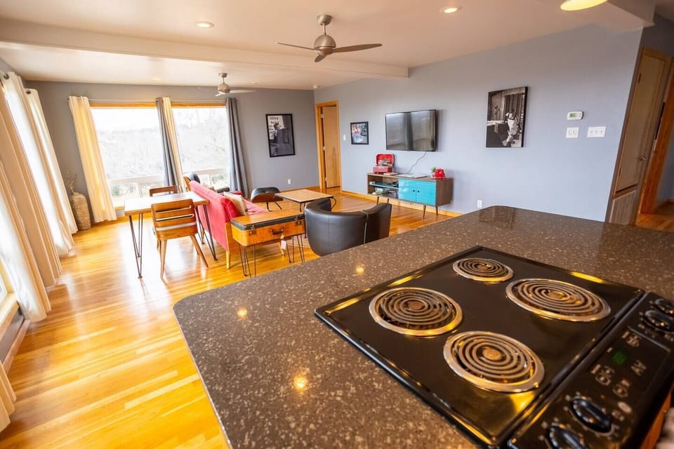 The openness between the kitchen and living spaces allow for gathering, conversation or TV watching from either area. 