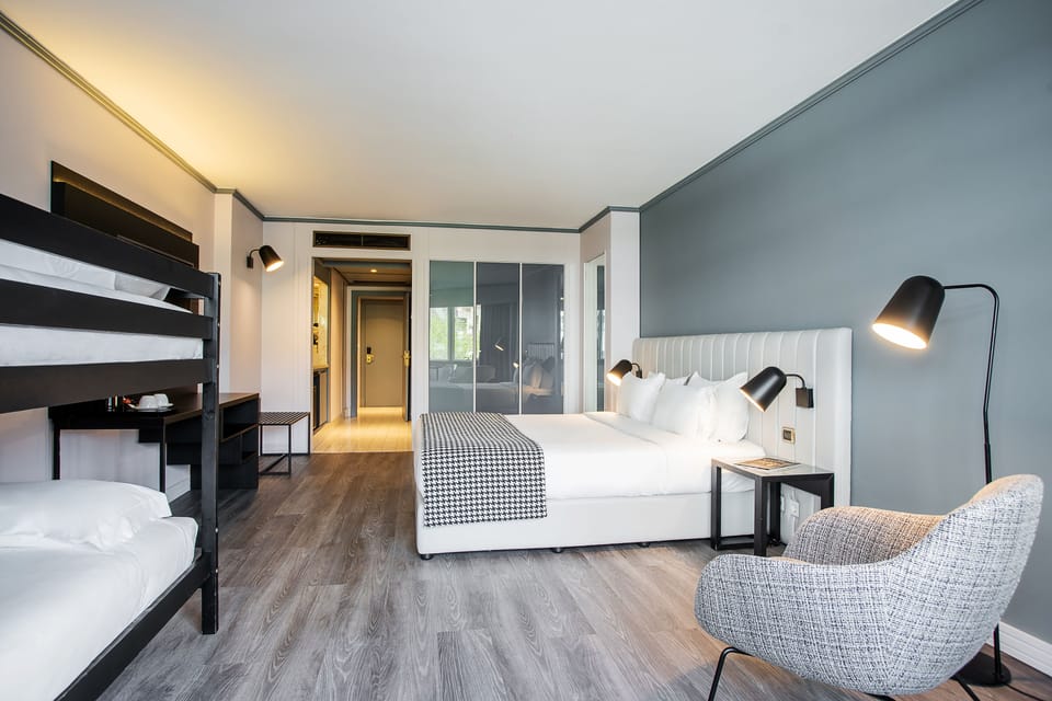 Family Room | Minibar, in-room safe, free WiFi, bed sheets