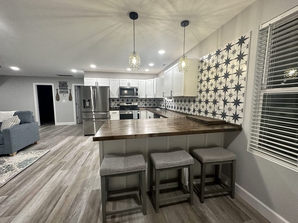 Kitchen has seating at the bar for 3.