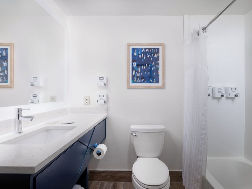 Room, 2 Queen Beds, Poolside | Bathroom | Eco-friendly toiletries, hair dryer, towels