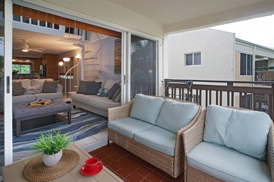 Large balcony leads into the living room and overlooks the beach