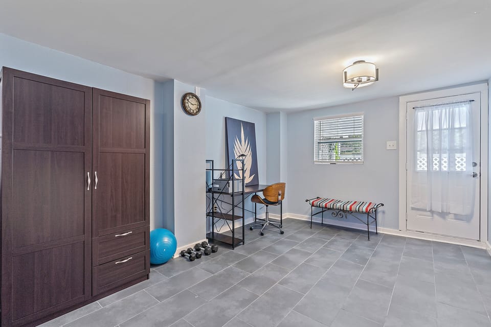 Yoga mats, exercise balls, and free weights. Extra workspace and network printer