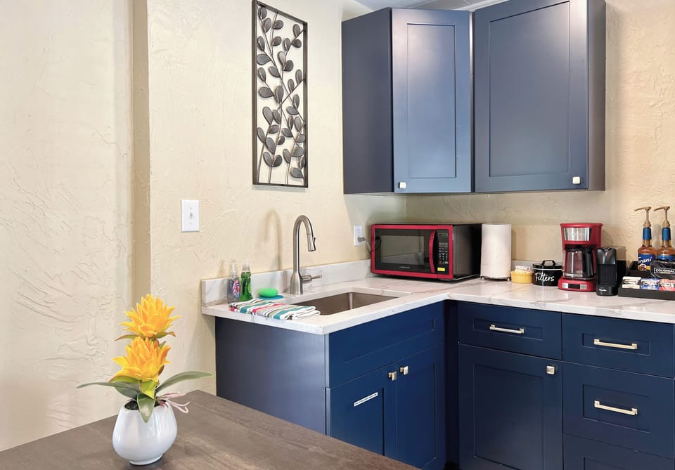 Wet bar with modern shaker cabinets and Quartz® stone counters