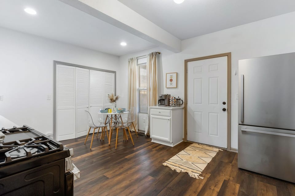 Open-concept kitchen and dining space with plenty of room to prep meals, enjoy breakfast, or unwind after exploring Downtown KC.