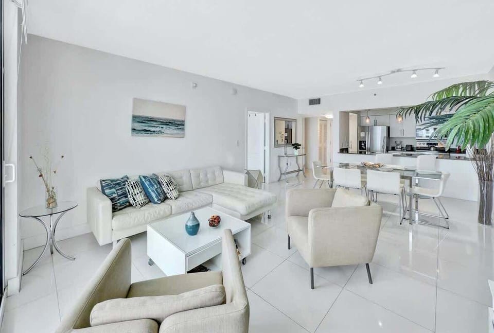 Bright and airy living room with stunning ocean views right from your private balcony.