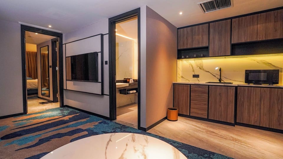 Premier Double Room | Living area | 50-inch TV with cable channels