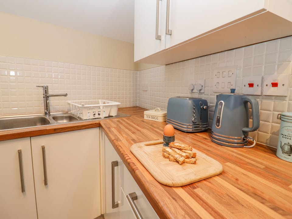 Fridge, electric kettle, toaster, cookware/dishes/utensils