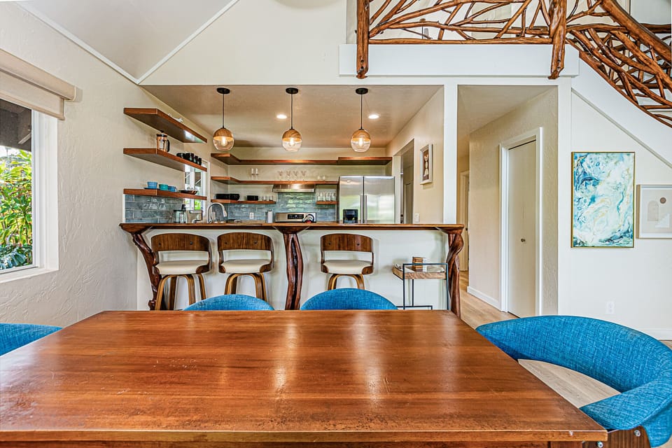 Dining table and breakfast bar provide indoor dining options