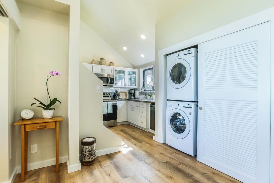 Enjoy the convenience of a private washer and dryer located just off the kitchen for easy laundry during your stay.