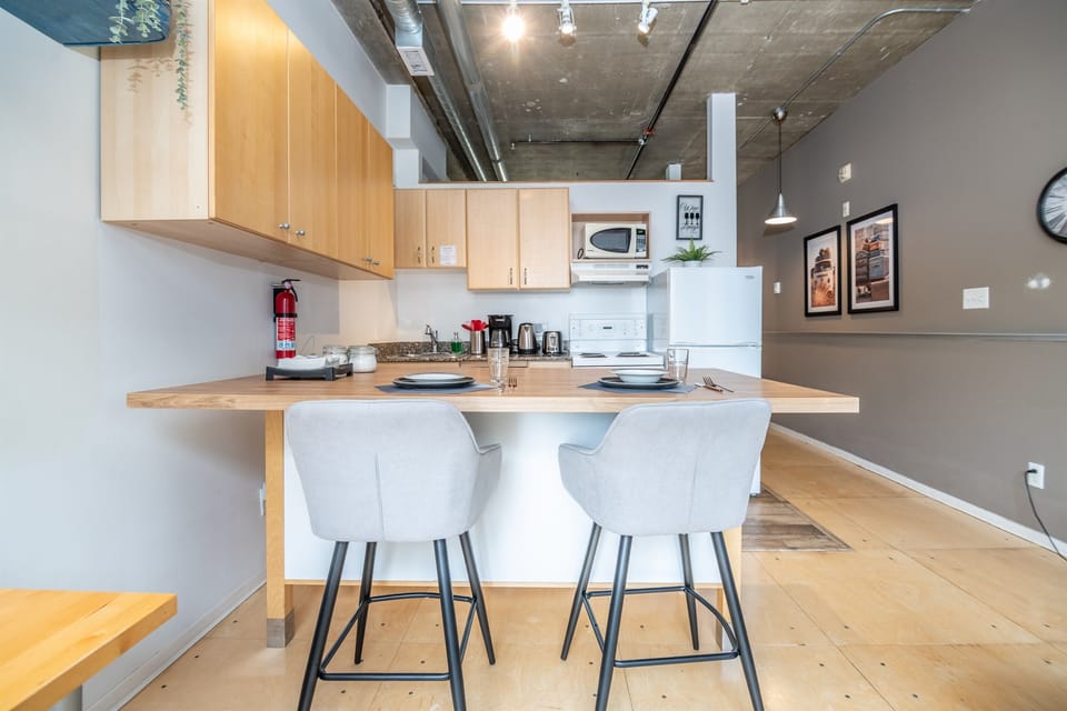 Cozy and well equipped kitchen for a clean cooking experience, including a decent size island to seat comfortable two guests