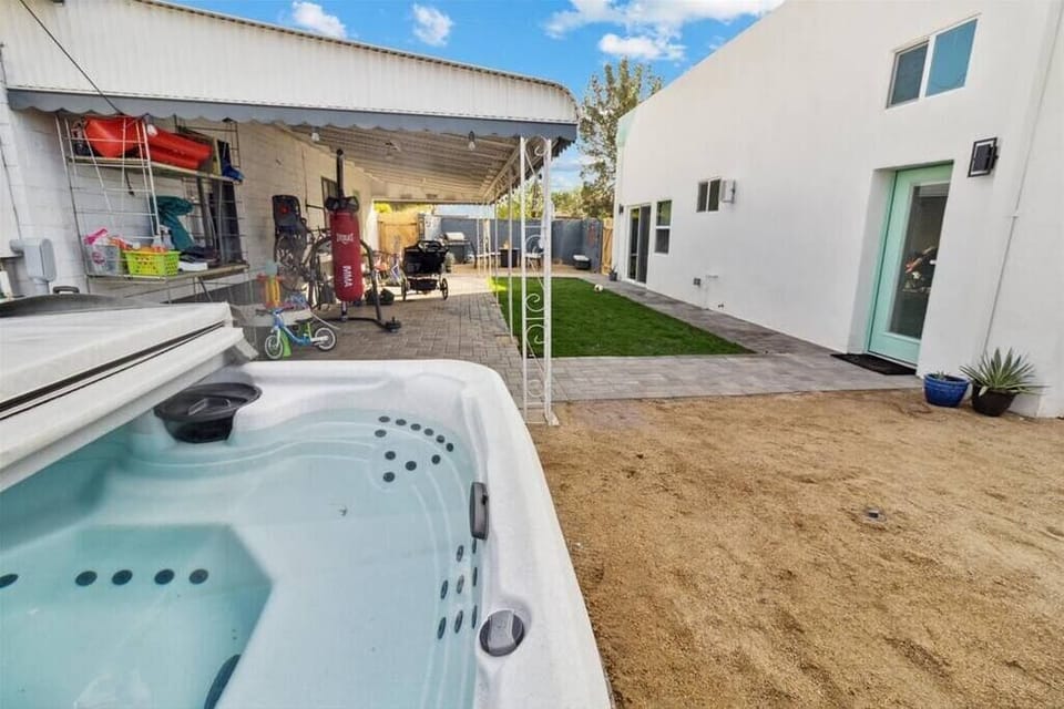 Shared backyard with hot tub.