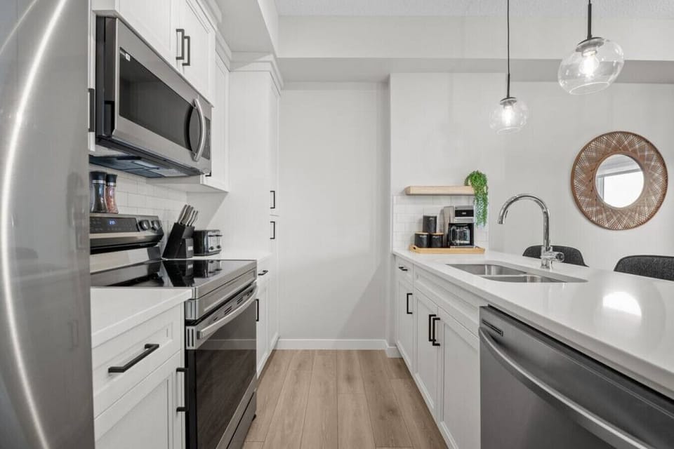 Full kitchen with a drip coffee machine, ground coffee, tea, sugar and basic condiments (ketchup, mustard and relish.)