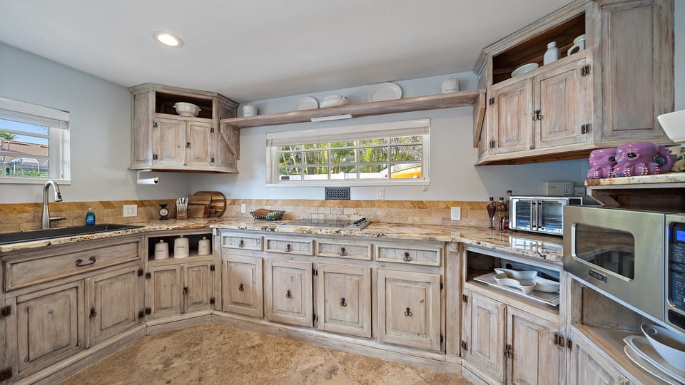 Spacious fully-stocked kitchen perfect for at-home meal prep with friends and family.