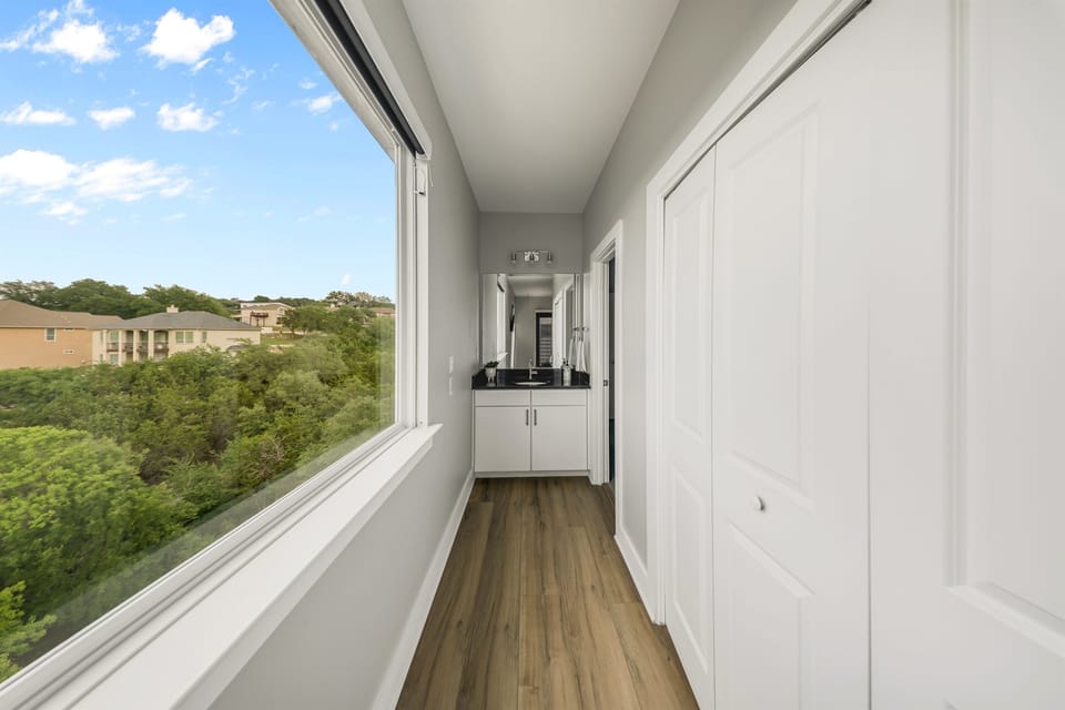 - Bright guest bathroom with sleek vanity and walk in shower combo - Clean tile design creates a relaxing lake vacation morning routine - Functional layout supports guests with comfort style and ease