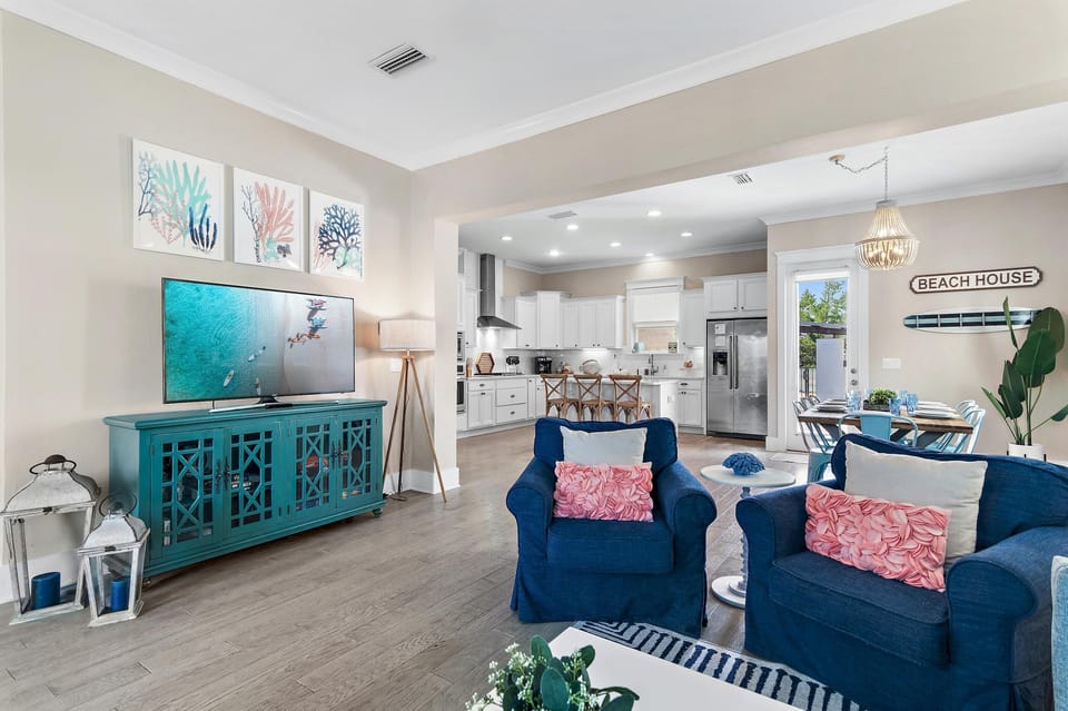 Bright and airy living room with cozy navy seating and vibrant accents