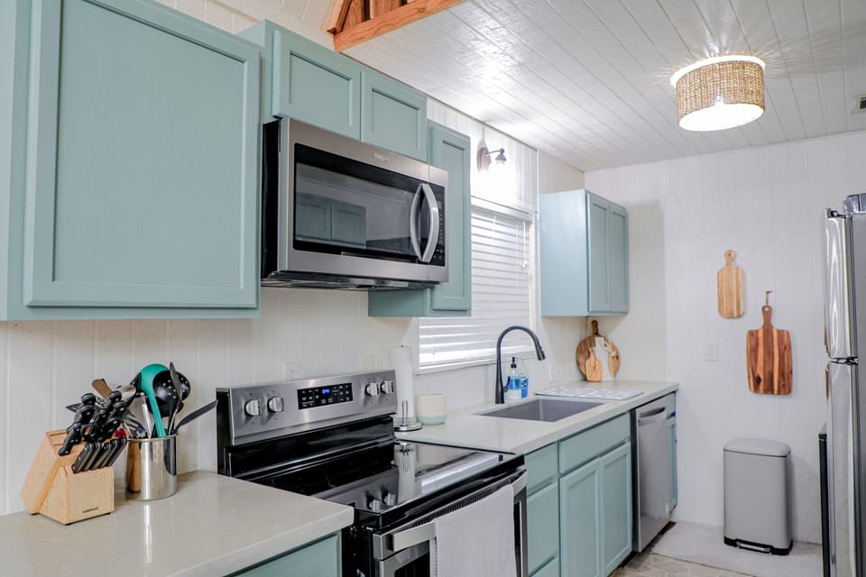Fully furnished kitchen with microwave, dishwasher, washer and dryer.