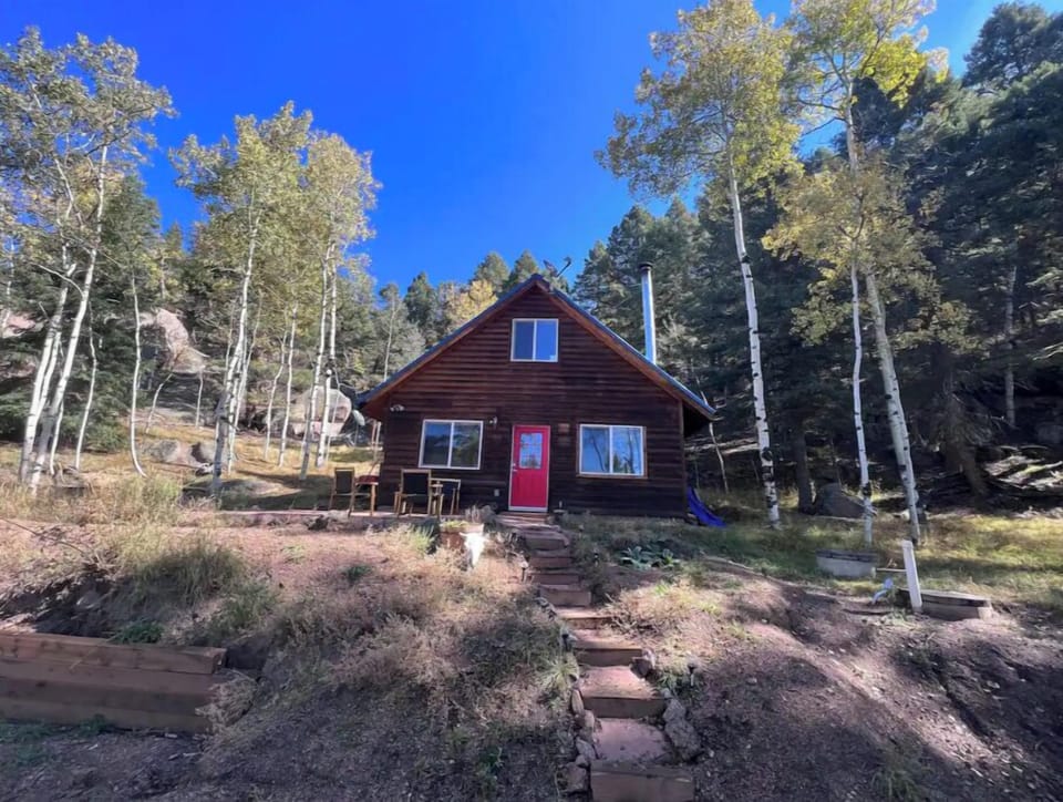 red door cabin front yard.