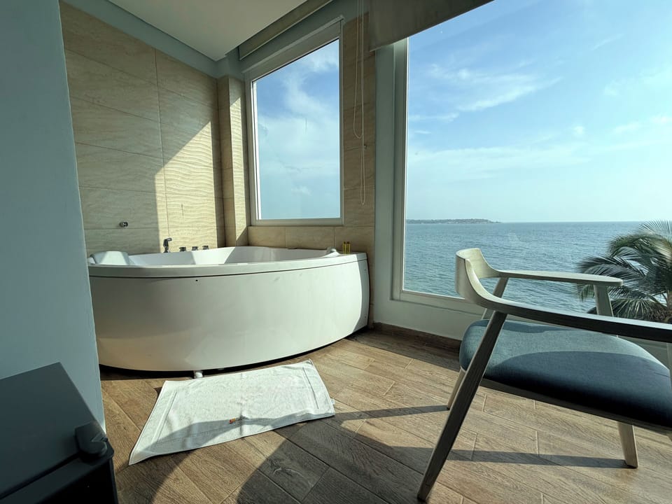 Superior Double or Twin Room, Hot Tub, Sea View | Bathroom | Shower, rainfall showerhead, towels, soap