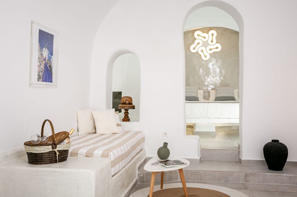 Cave Suite with Sunset View | Living area | Flat-screen TV