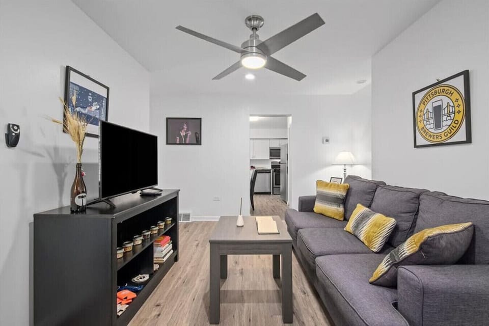 Alternate living area view showing sofa bed and entertainment setup