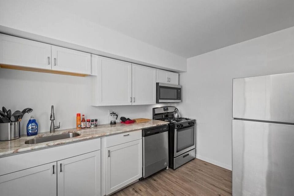 Full kitchen with stove, oven, microwave, and full-size refrigerator