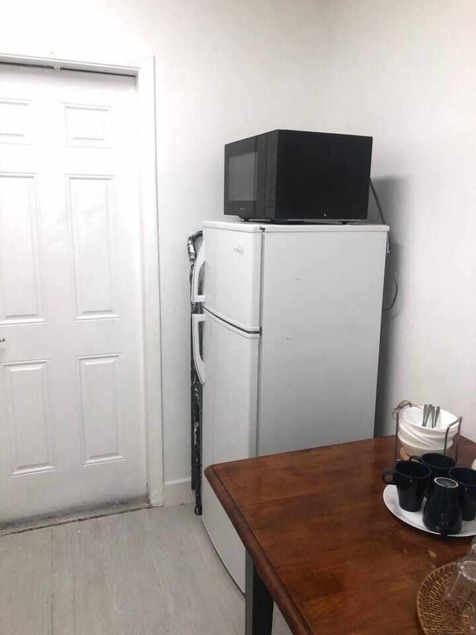 Refrigerator and microwave 
Kitchen door to access backyard