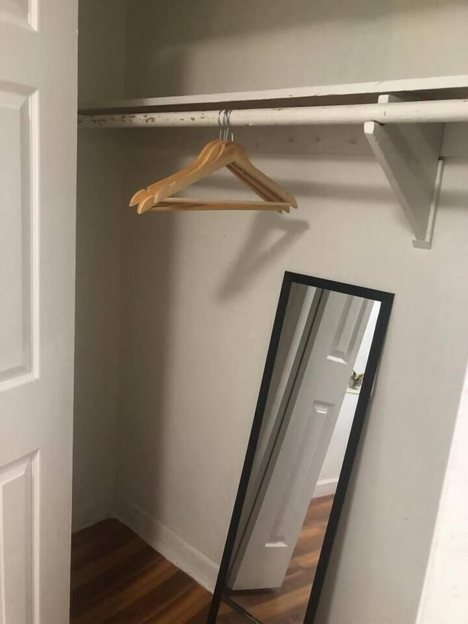 Closet with hangers and full-length mirror to plan those outfits