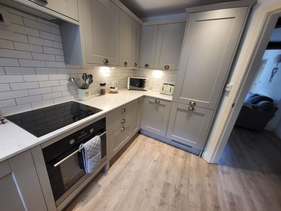 Kitchen showing integral fridge and freezer