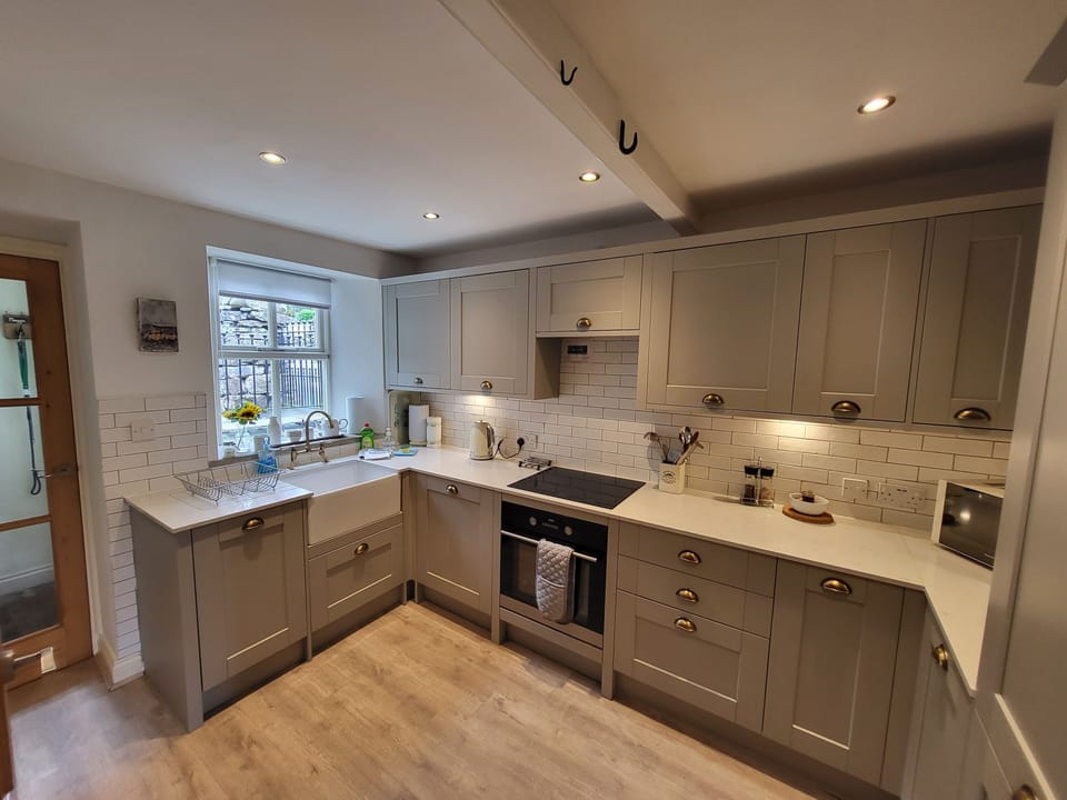 Kitchen showing sink and integral dishwasher