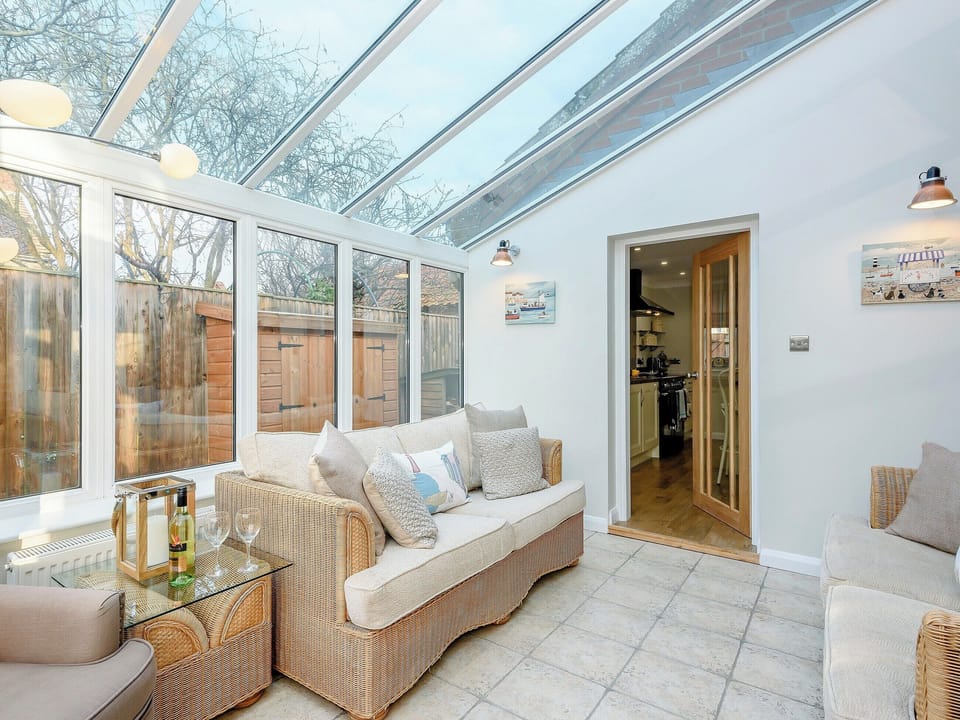 Relaxing conservatory | Corner House, East Runton