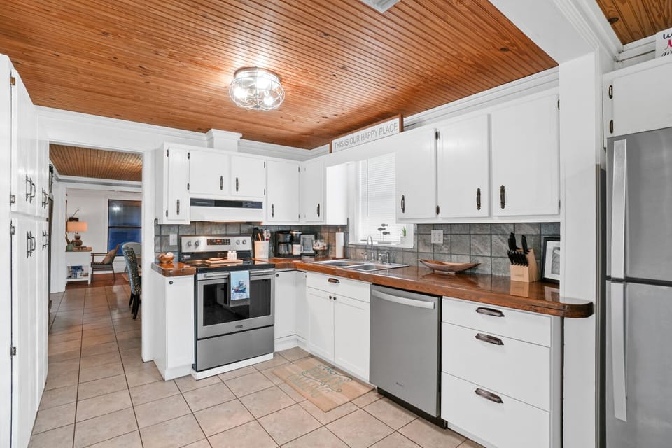 Large kitchen with a ton of amenities and beautiful pecky cypress counter tops