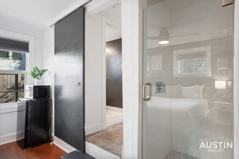 Full shower with all the essentials plus bathroom behind the sliding door