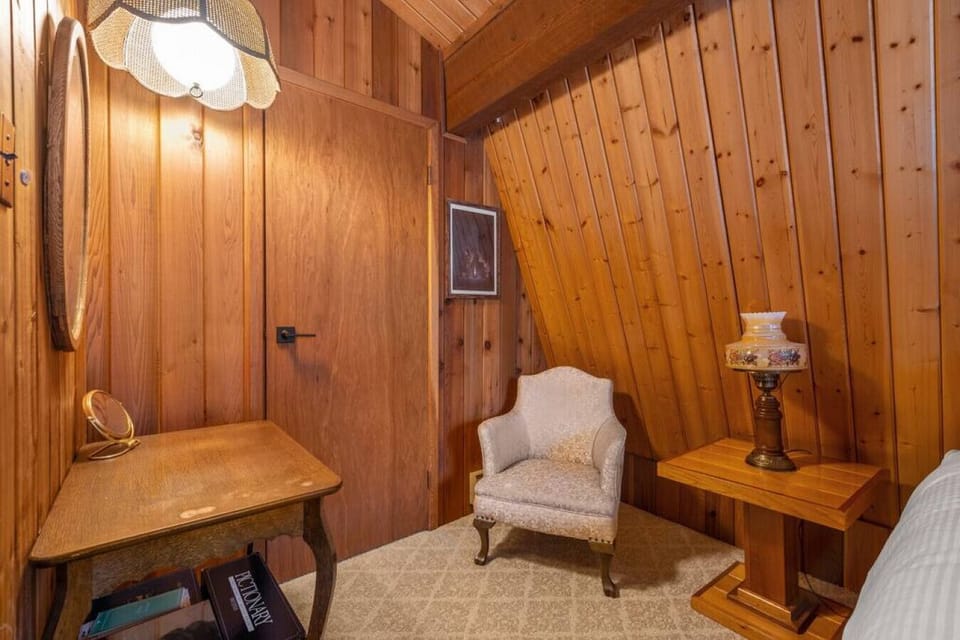 Primary bedroom upstairs with a king bed & private balcony.