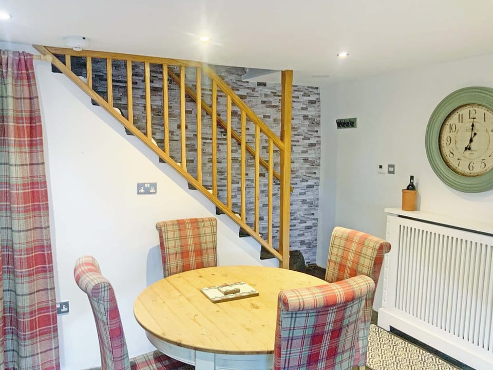 Charming dining area with staircase | Betsy Cottage, Windermere