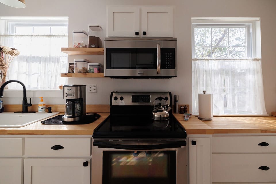 Electric oven and range with microwave overhead. Locally roasted coffee provided! 