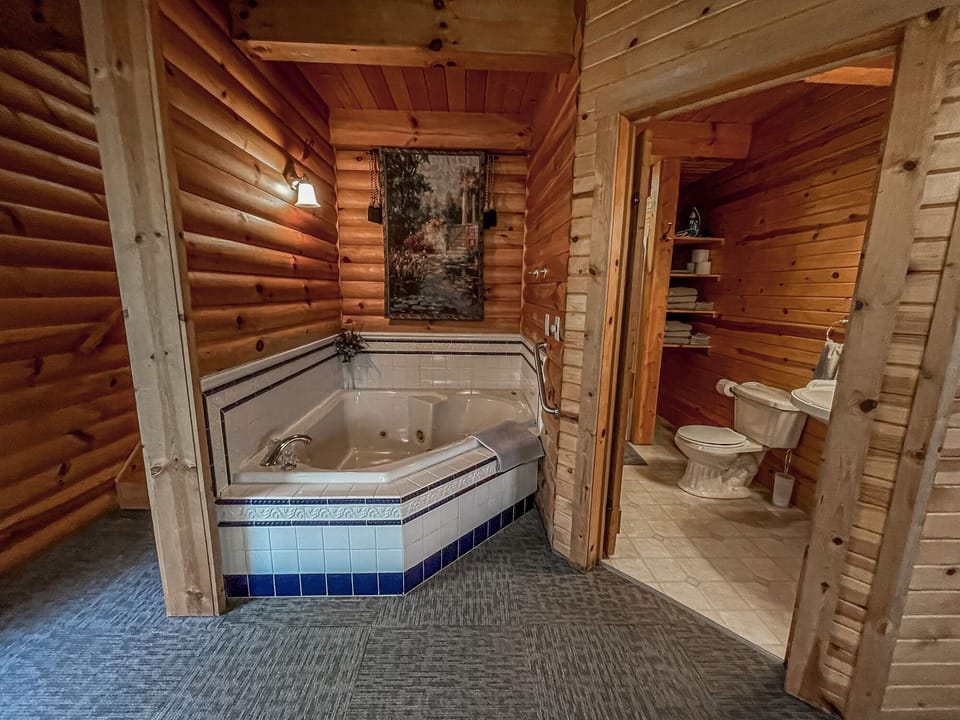 Steps to loft bedroom, whirlpool tub, bathroom. (L. to R. )