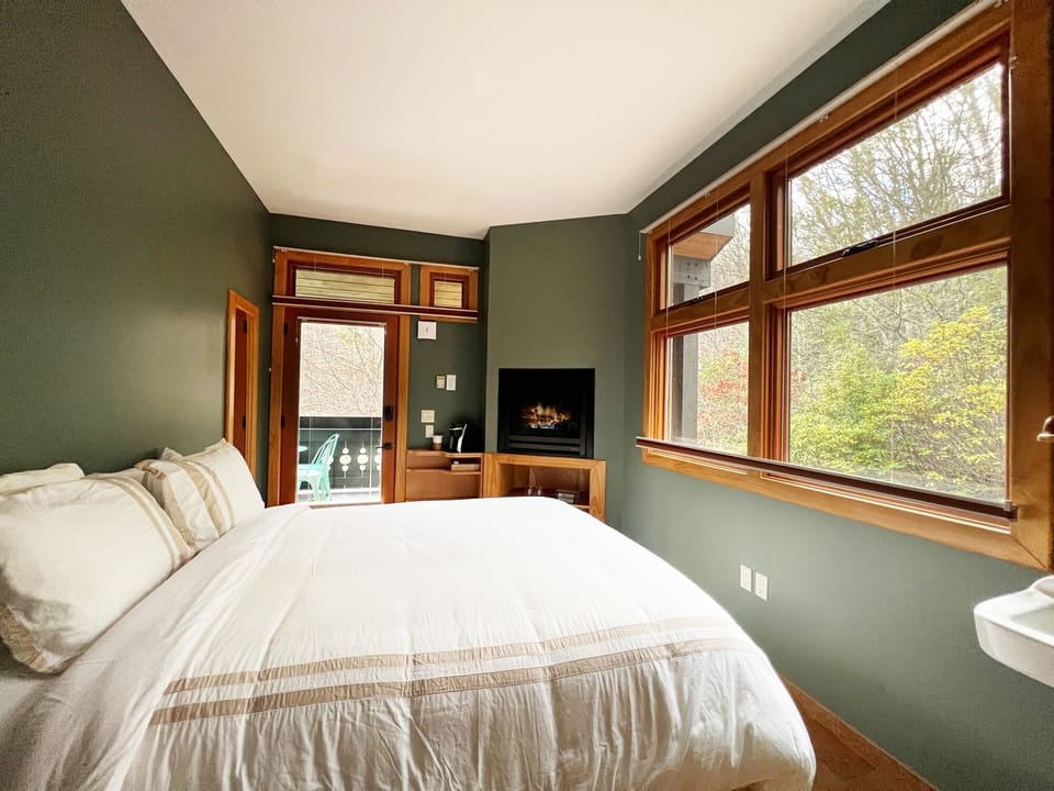 The Second bedroom featuring a queen bed and XL windows