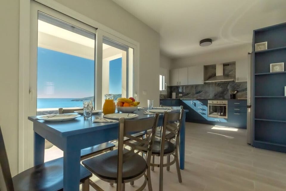 An open floor plan provides large kitchen and dining for six on the ground floor