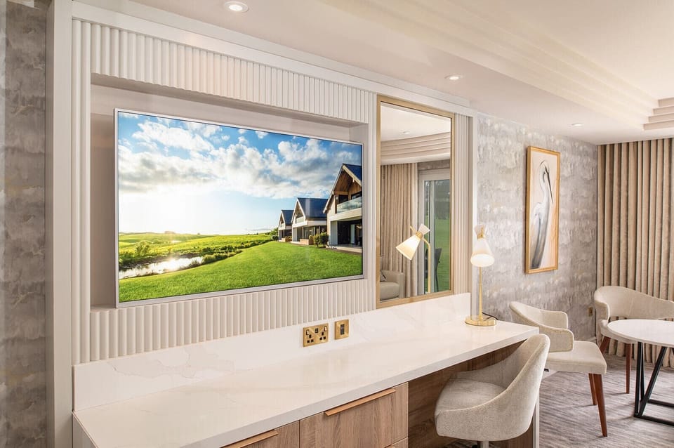 Garden Family Room | Desk, laptop workspace, blackout drapes, iron/ironing board