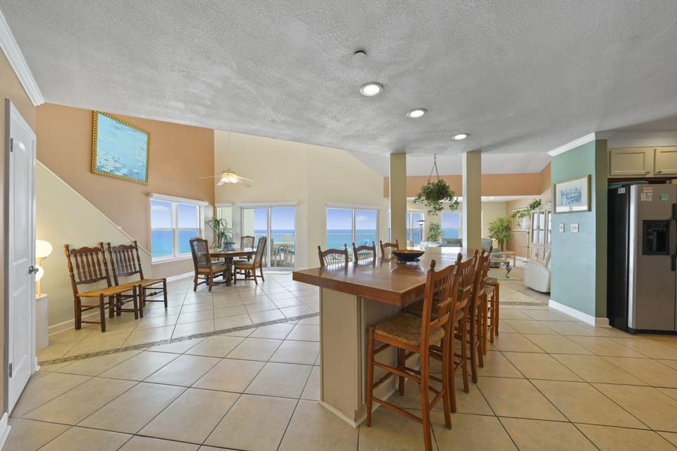 Spacious fully equipped kitchen with breakfast bar in Cabana Club Destin beachfront condo.