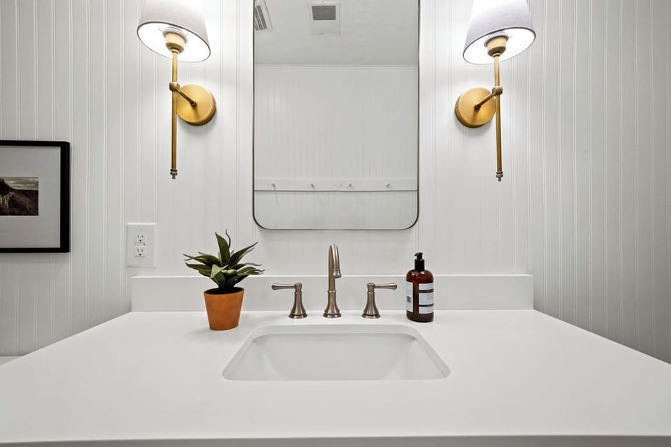 Bright vanity with modern lighting, the perfect place to refresh and unwind.