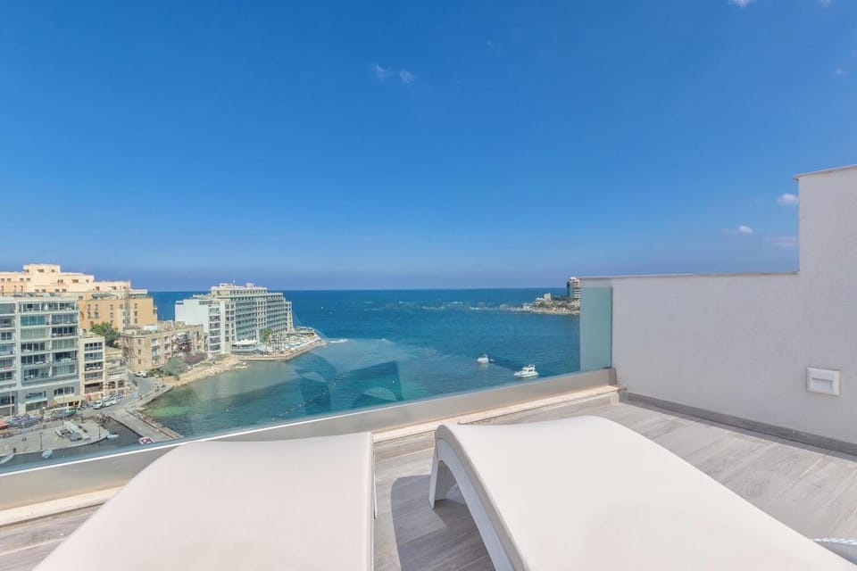 The ultimate view :) 10th floor- FULL interconnecting private roof terrace overlooking the picturesque Spinola Bay and unobstructed sea and ocean views -   two sun-beds, top of the range BBQ, sink with storage space, and 6 person table with chairs