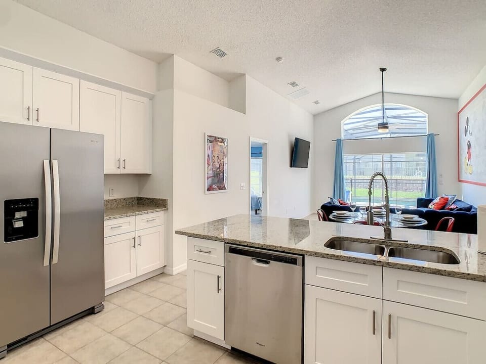 Another view of our kitchen, featuring the fridge and ample space.