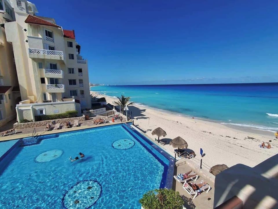 Beachfront pool and Caribbean Sea