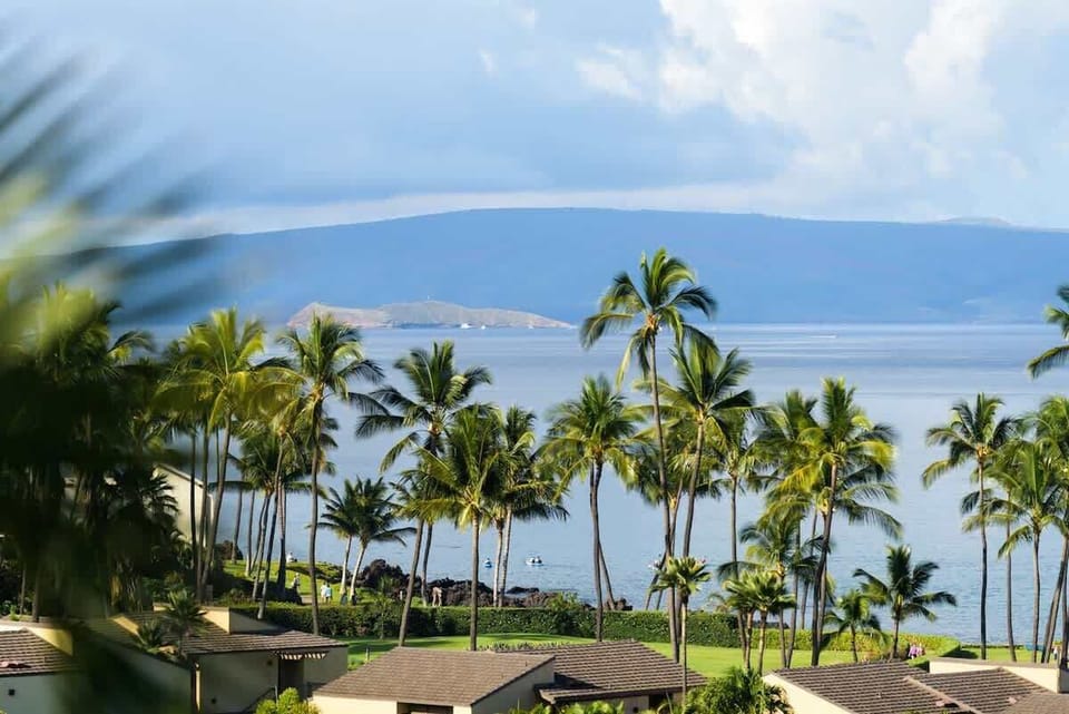View looking south toward Molokini Crater and behind it is the island of Kaho'olawe