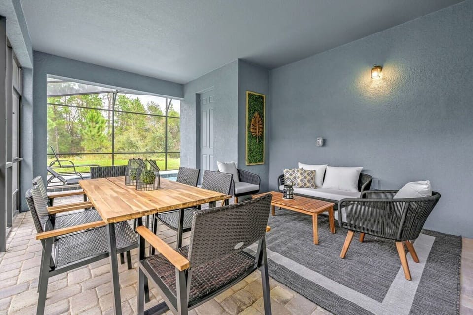 Enjoy covered outdoor dining and lounging in the backyard.