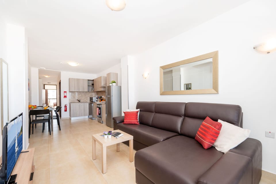 Standard Apartment, 1 Bedroom, Partial Ocean View | Living area | 43-inch LCD TV with satellite channels, TV