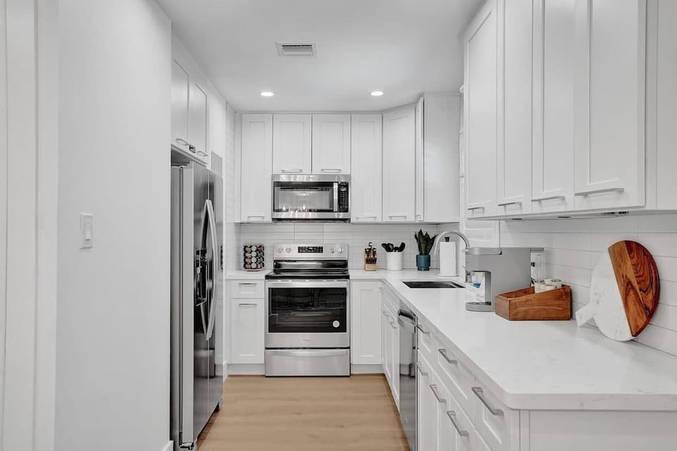 Fully stocked kitchen with all of the supplies and kitchen tools and spices you need to make a wonderful family meal.